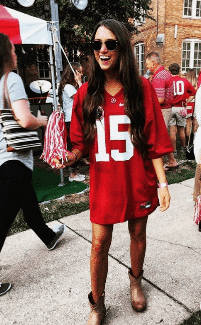 An evergreen oversized tunic college tailgate look