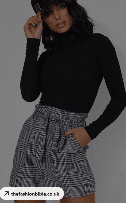 plaid black turtle neck shirt with check skirt