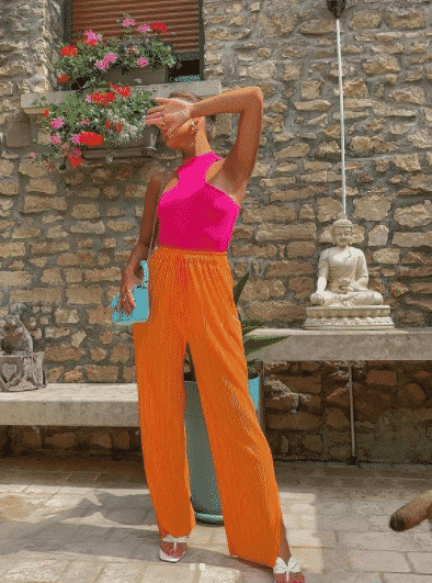 Orange pants with hot pink shirt