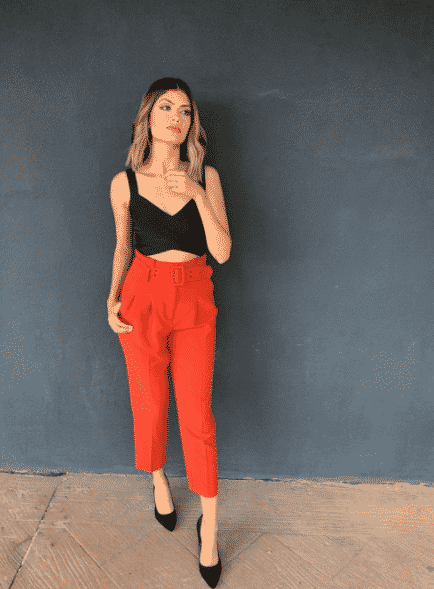 orange pants with black top