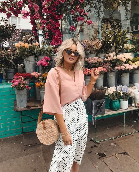 Loose pink shirt with a polka dotted skirt