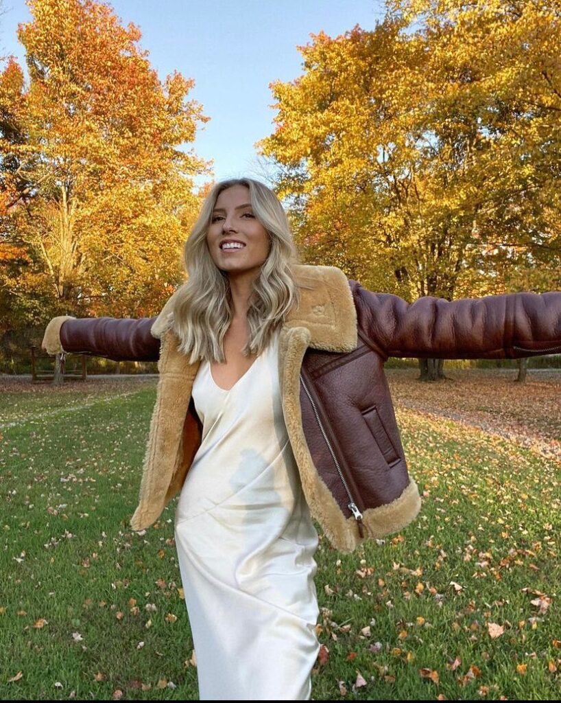 white silk dress with aviator jacket