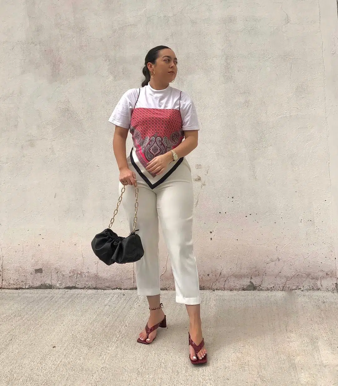 Red brown bandana top layered over a white tee with white trousers
