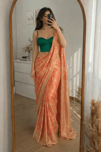 coral Banarasi silk saree with gold woven motifs