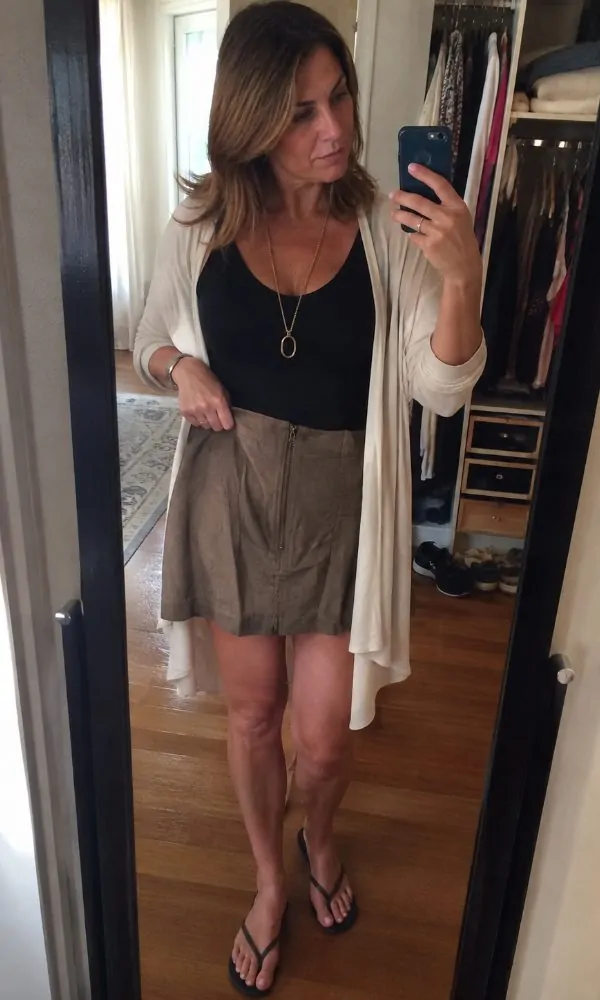 Balancing proportions by pairing bare arms with a longer hemline