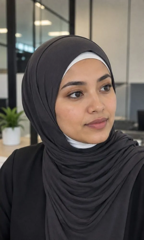 Woman wearing charcoal cotton hijab over a white underscarf