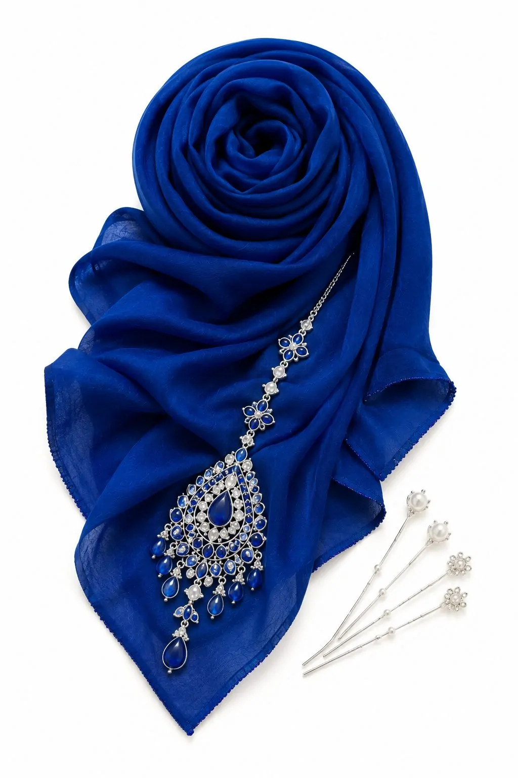 Bold royal blue hijab with gold and blue maang tikka flat lay