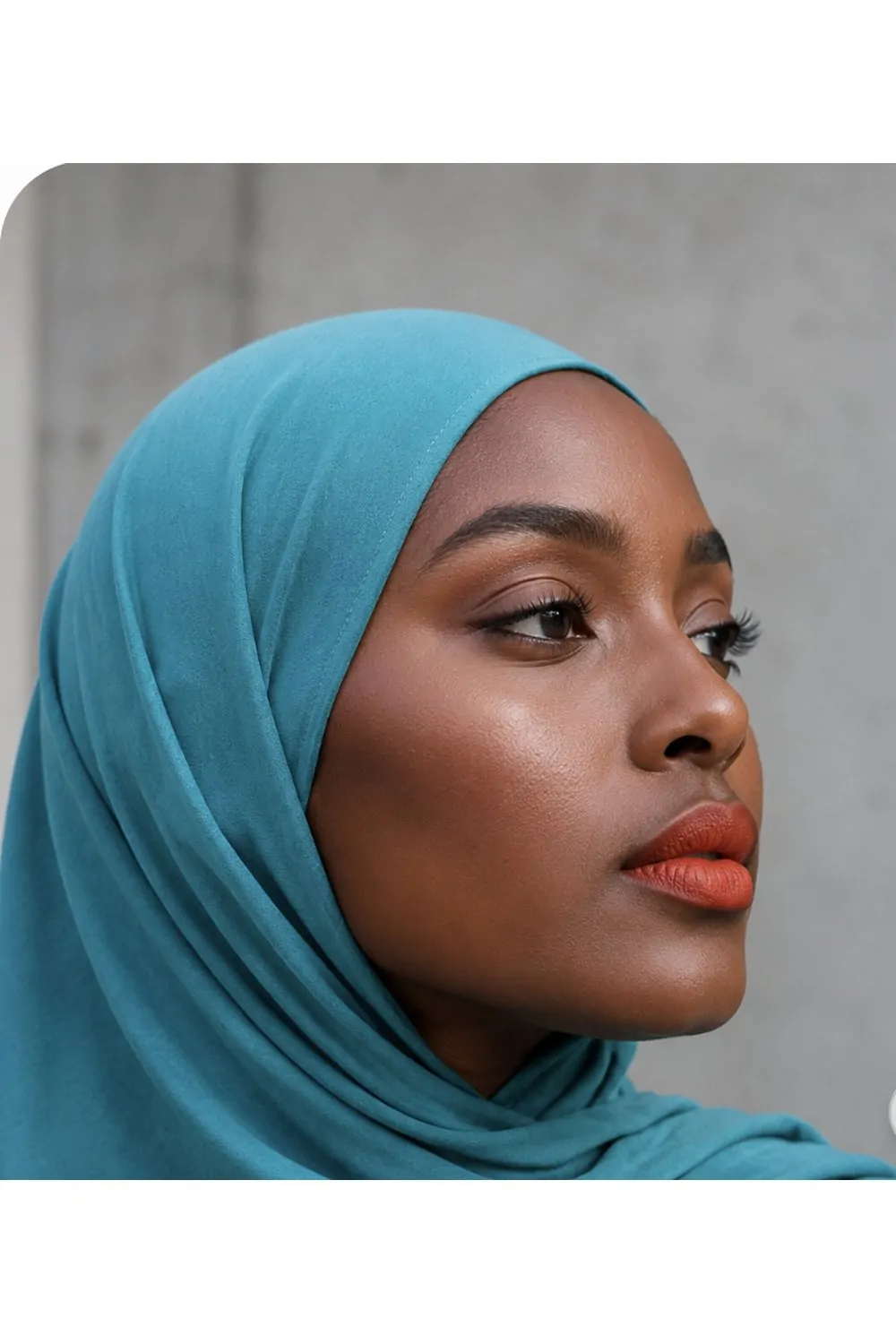 Turquoise hijab with coral lips makeup look
