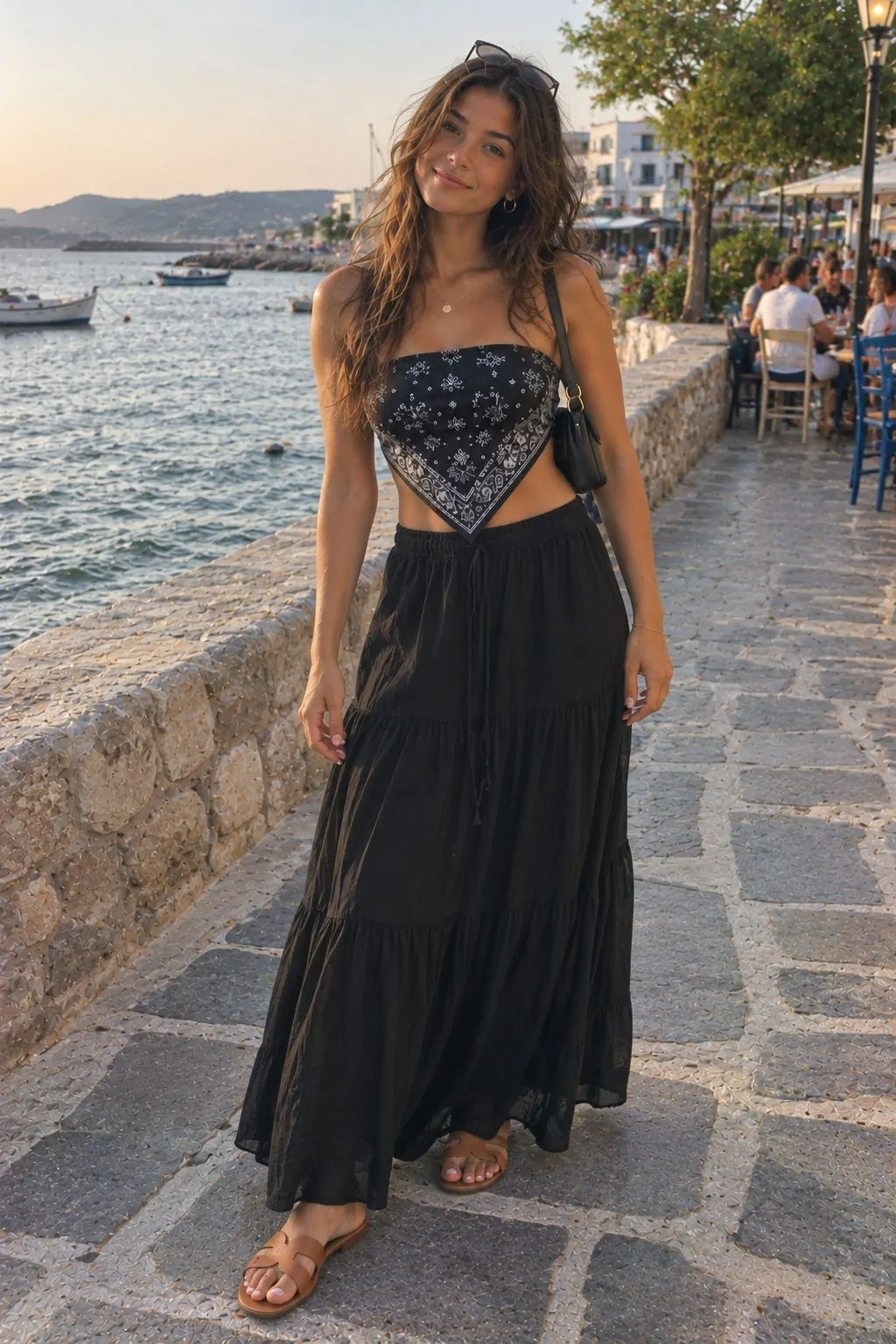 Black and white printed bandana top with a flowy black maxi skirt near the sea